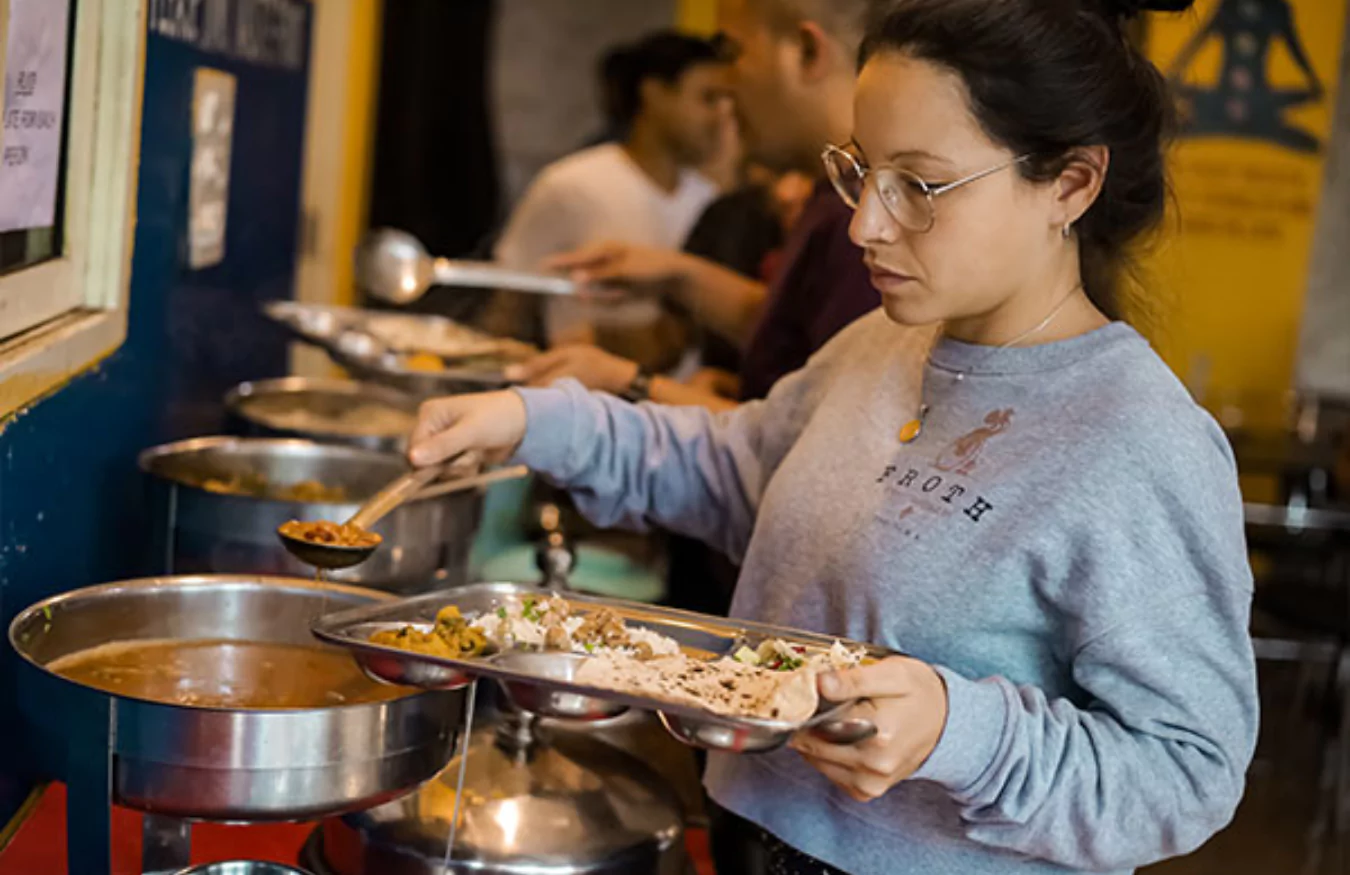 Community dining with nutritious Sattvic meals at our yoga school.